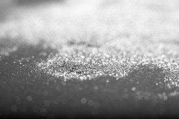 Golden and silver glitter backgound with bokeh abstract blur effect 