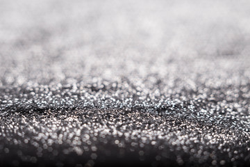 Golden and silver glitter backgound with bokeh abstract effect