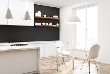 Black wooden kitchen corner, white chairs