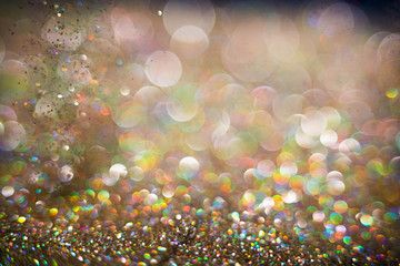 Golden and silver glitter backgound with bokeh abstract effect