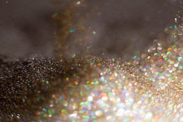 Golden and silver glitter backgound with bokeh abstract effect