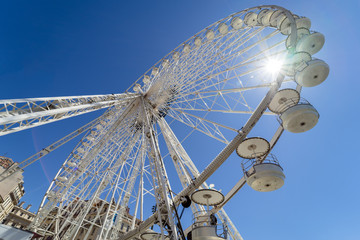 Aerial ferris wheel blue sky sun fun