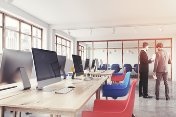 Blue and red chairs office, close up toned