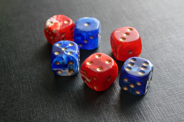 Dice lying on a black textured surface