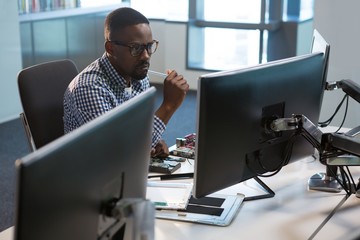 Computer engineer repairing motherboard at desk