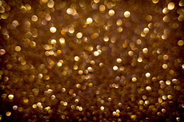 Golden and silver glitter backgound with bokeh abstract effect
