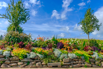 Rockery in St-Fraimbault a Normandy village in the Orne in summer, France