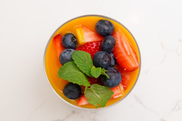 Berry dessert in glass shot from above