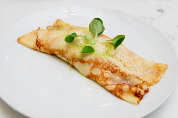 Pancake with cheese on plate