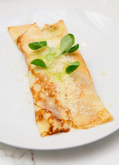 Pancake with cheese on plate