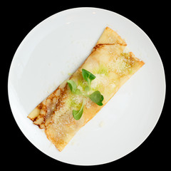 Pancake with cheese shot from above, isolated on black