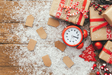 Winter sale concept. Christmas discount with gift boxes over wooden background. Sales Discount Tag