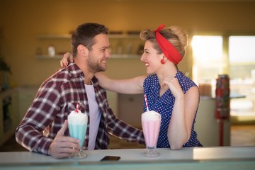 Couple romancing in restaurant