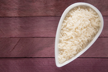 Raw white rice in the bowl - Oryza sativa