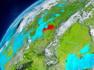 Space view of Latvia in red