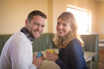 Couple having coffee in restaurant