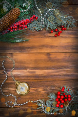 Christmas wooden background with snow branch. Top view with copy space for your text