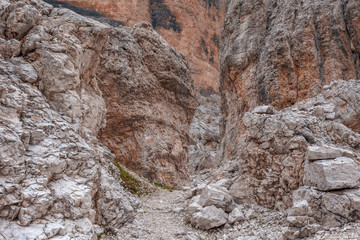 Path in the middle of giant boulders, Travenanzes Valley,  Dolomites, Italy
