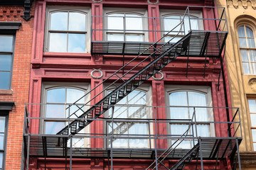 Fototapeta na wymiar Red Brick Building / Apartment Fire Escape 