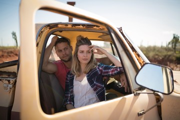 Couple sitting together in a car