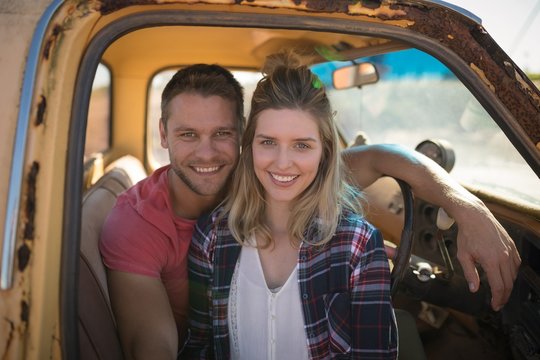Couple sitting together in a car
