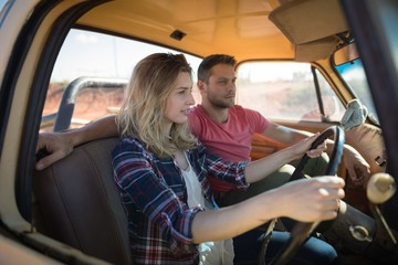 Couple sitting together in a car