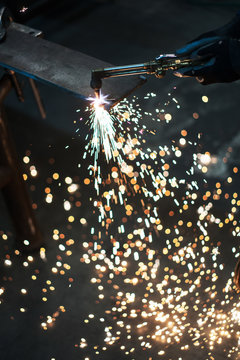 Sparks fly from oxy acetylene welding