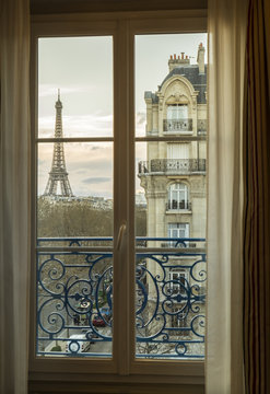 The Eiffel Tower, Paris, France, through an apartment window.