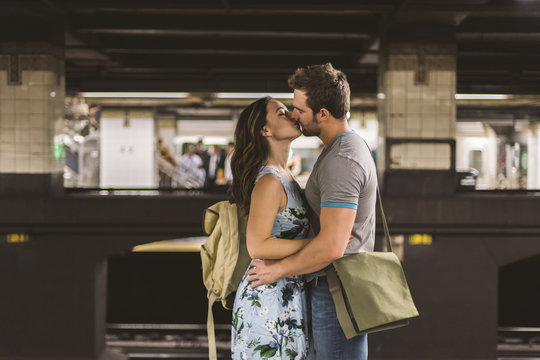 Young couple kissing in the subway of NYC