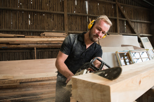 Carpenter with chain saw