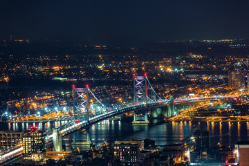 Aerail view of Ben Franklin Bridge by night spaning Delaware river, in Philadelphia