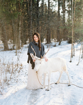 Female with white reindeer