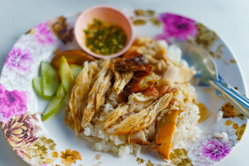 chicken with sauce over rice
