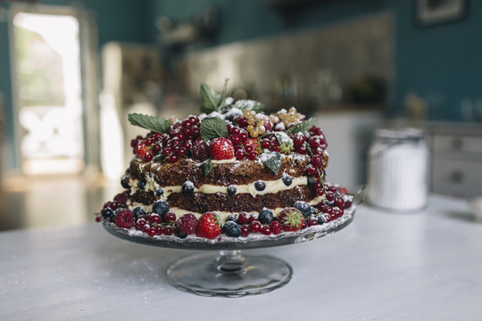 Mother And Daughter Baking A Delicious Naked Cake