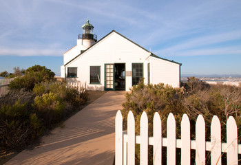 OLD POINT LOMA LIGHTHOUSE UNDER BLUE CIRRUS SUNSET CLOUDSCAPE AT POINT LOMA PENINSULA IN SAN DIEGO IN SOUTHERN CALIFORNIA UNITED STATES