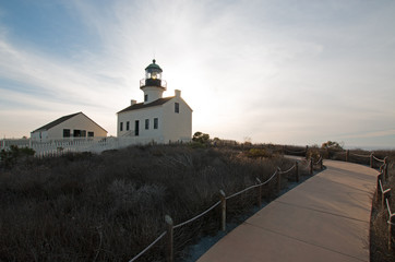 Fototapeta na wymiar OLD POINT LOMA LIGHTHOUSE UNDER BLUE CIRRUS SUNSET CLOUDSCAPE AT POINT LOMA PENINSULA IN SAN DIEGO IN SOUTHERN CALIFORNIA UNITED STATES