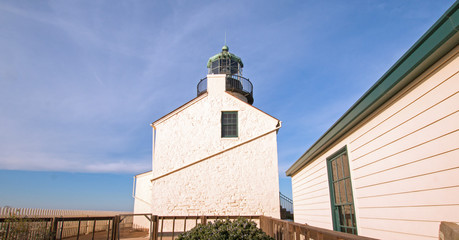 OLD POINT LOMA LIGHTHOUSE UNDER BLUE CIRRUS SUNSET CLOUDSCAPE AT POINT LOMA PENINSULA IN SAN DIEGO IN SOUTHERN CALIFORNIA UNITED STATES