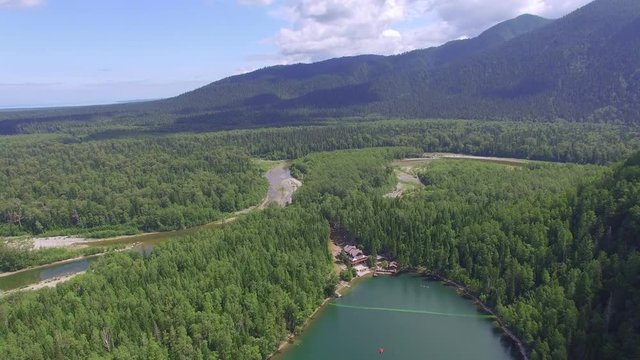 Aerial photography. Heavenly landscape of the landscape with a mountain lake in Siberia near Lake Baikal. Warm lake of the Snezhnaya River. Vydrino