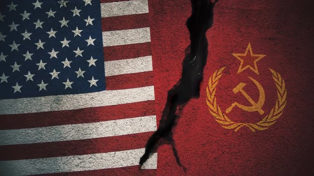 United States vs Soviet Union Flags on Cracked Wall
