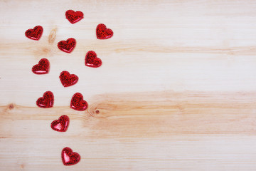 Red hearts on wooden background