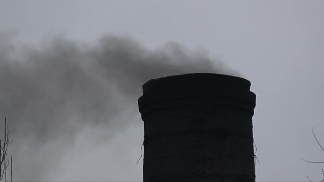 Black smoke comes from the factory pipe