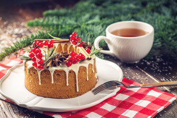 Homemade Christmas or New Year holiday berry cake decorated currants and rosemary. Concept of festive desserts