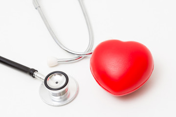 Red heart and a stethoscope. Isolated on white background. Studio lighting. Concept for healthy and medical
