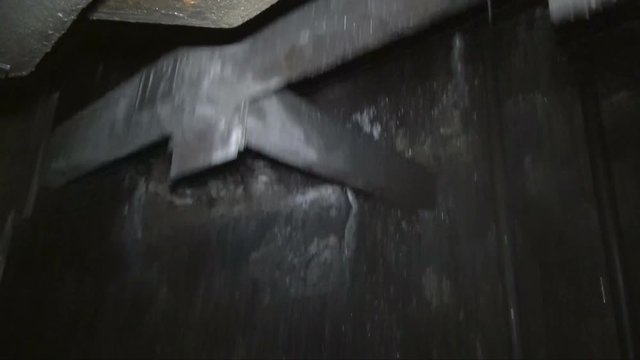 Descent into a coal mine in an elevator cage