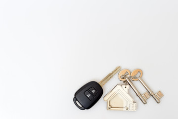 Car and house keys on table. Concept of success.