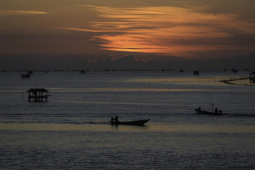 the landscape photo of fishing village in sunrise, the famous place for travel in Thailand