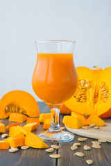 A wineglass of fresh pumpkin juice