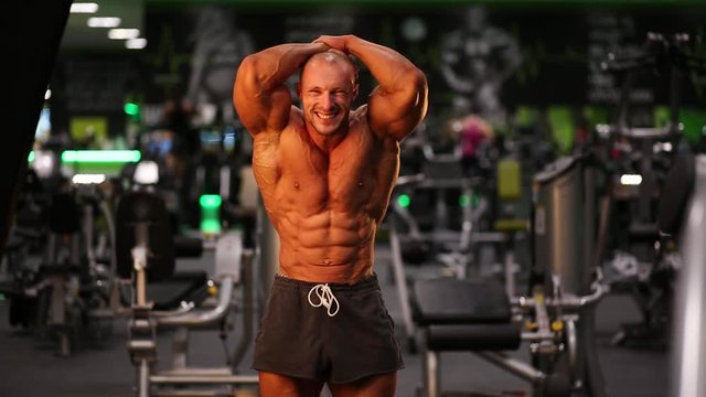 bodybuilder posing in a gym