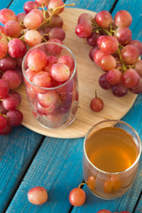 A glass of fresh grape juice