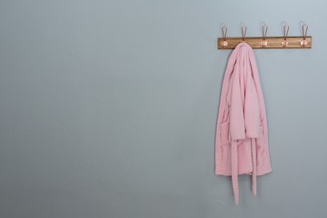 Fototapeta premium Bathrobes hanging on hook